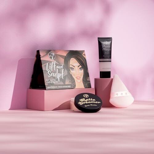 Assorted makeup products on pink background